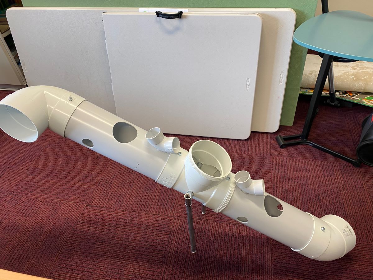 STEM enrichment device for meerkats designed by school students using PVC pipe.