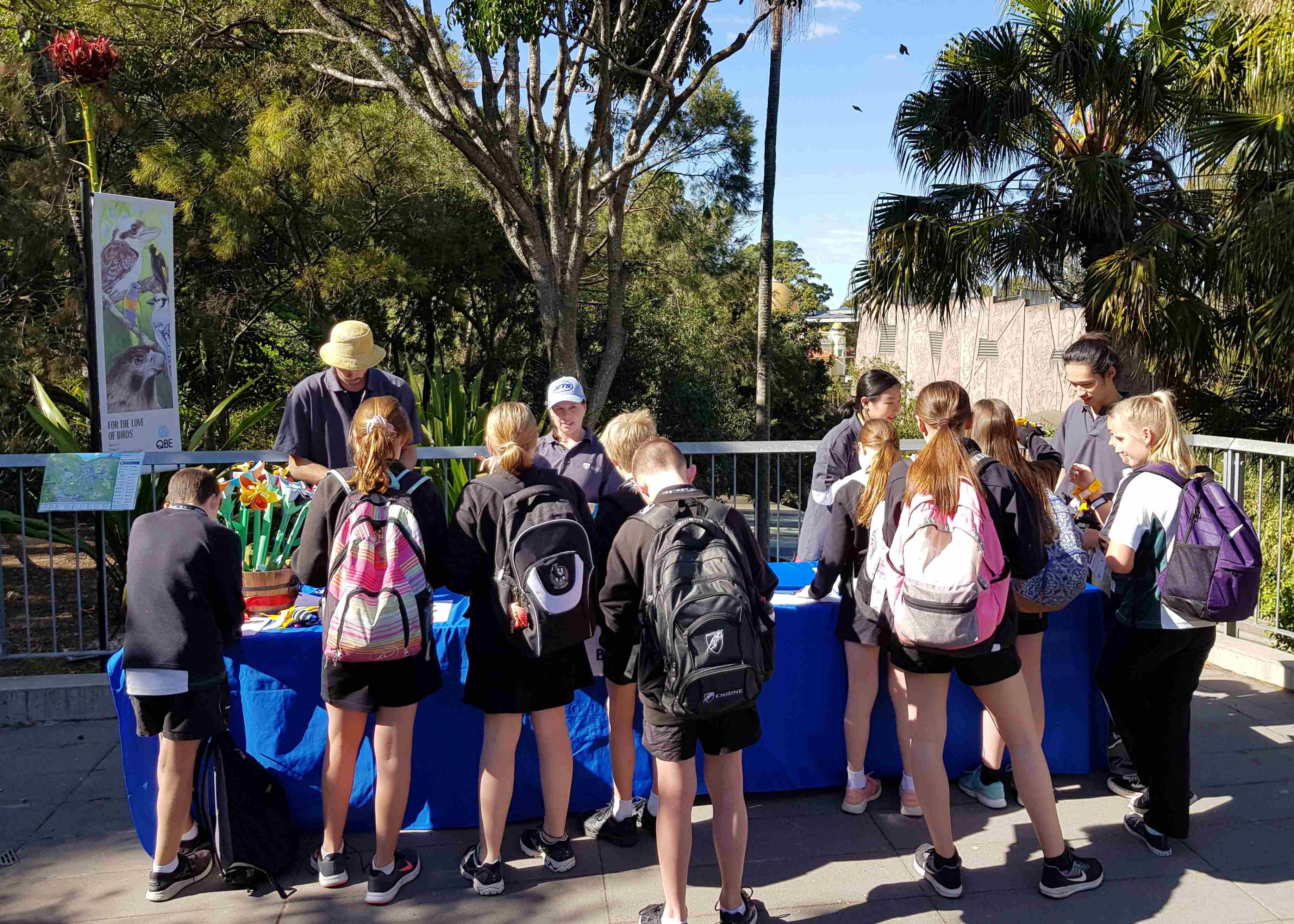 School students participating in an outdoor learning activity during National Science Week at a zoo.