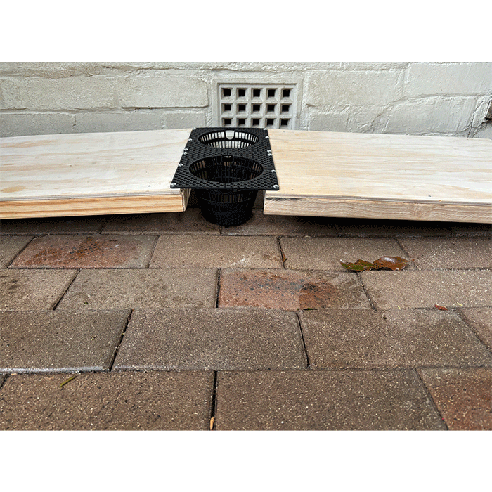 STEM‑designed enrichment device for platypuses featuring a raised platform and basket.