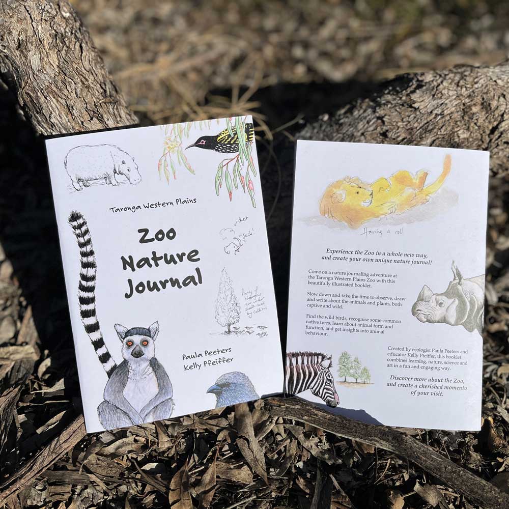 Zoo Nature Journal booklets displayed outdoors for a self‑guided nature learning activity.
