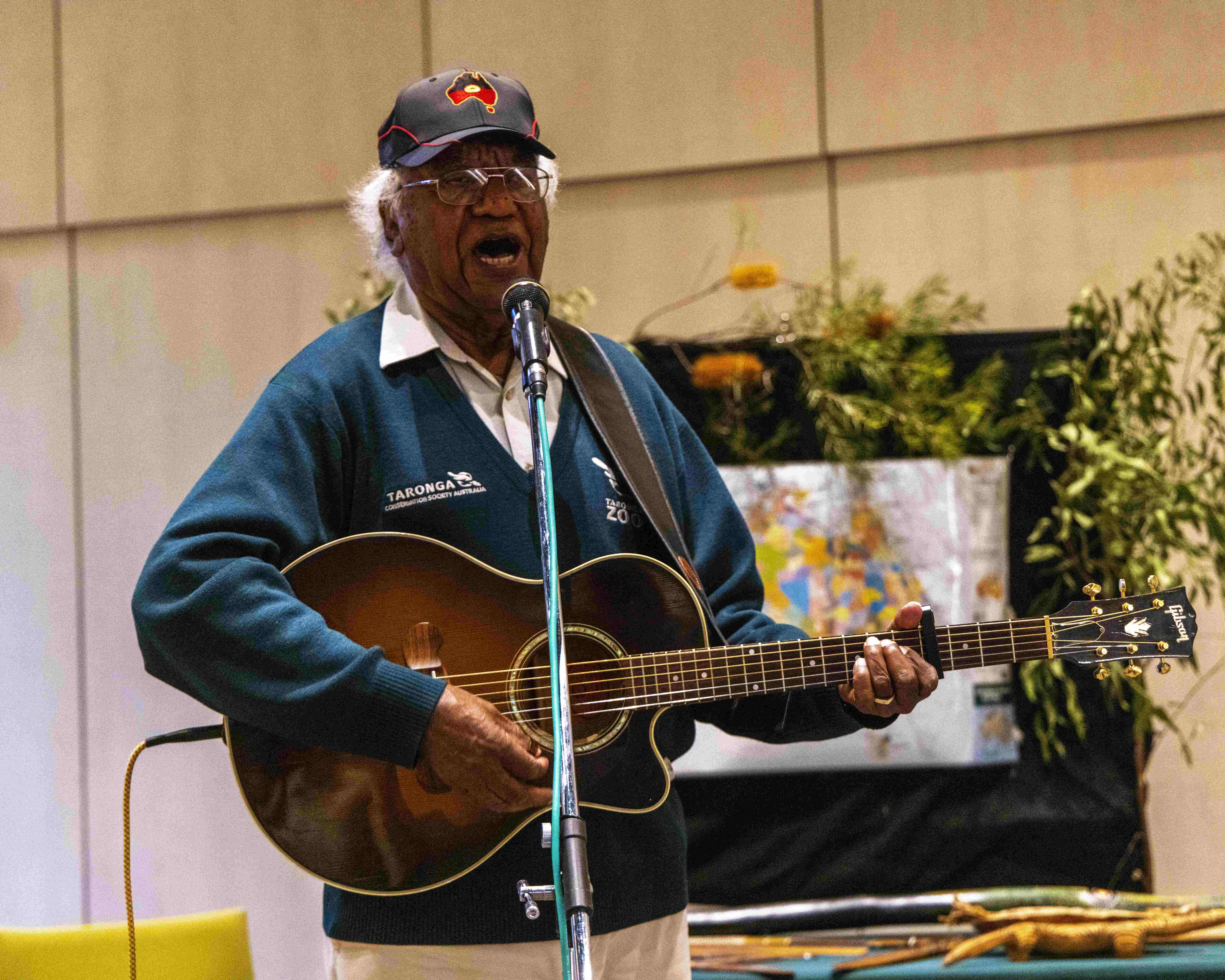 Educator presenting an Animals of the Dreaming storytelling session using music as part of an education program.